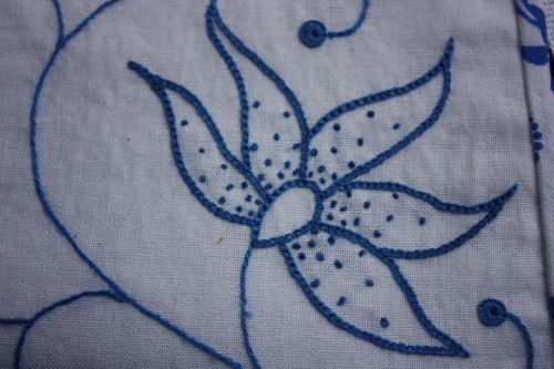 This flower is stitched with chain stitch and french knots.